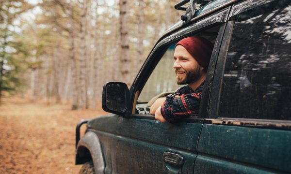 Man driving SUV