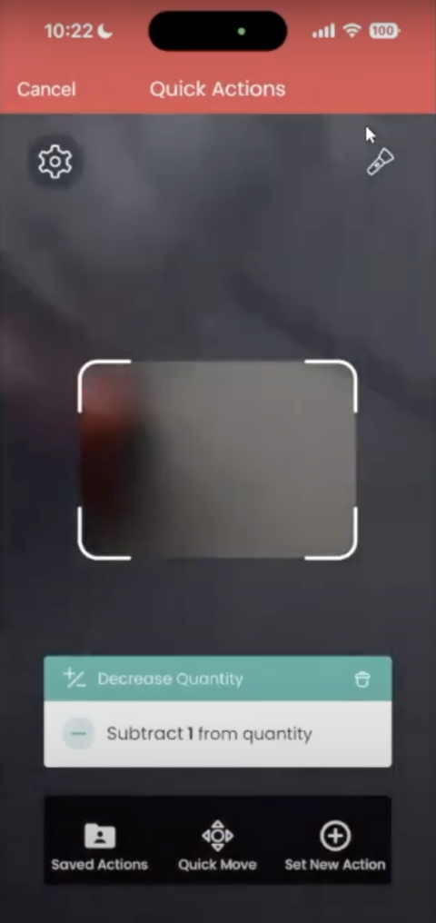 A view of the Quick Actions screen in the Sortly mobile app shows a barcode scanning field in the center of the screen and displays the chose action at the bottom of the screen, along with three more action buttons.