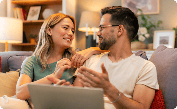 Two people sharing a laptop computer