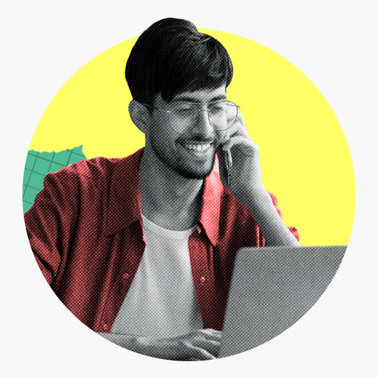 Man talking on phone while on laptop