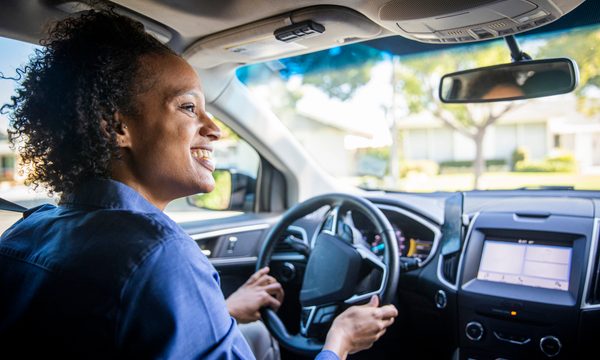 woman at the wheel of a car