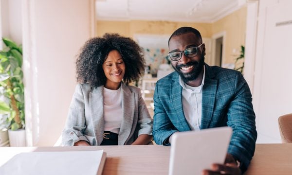 Two people doing financial planning.